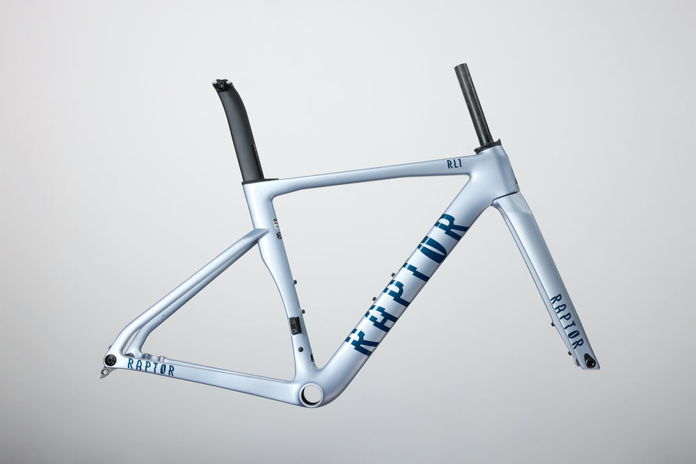 Cycling frame with Raptor branding on a grey background