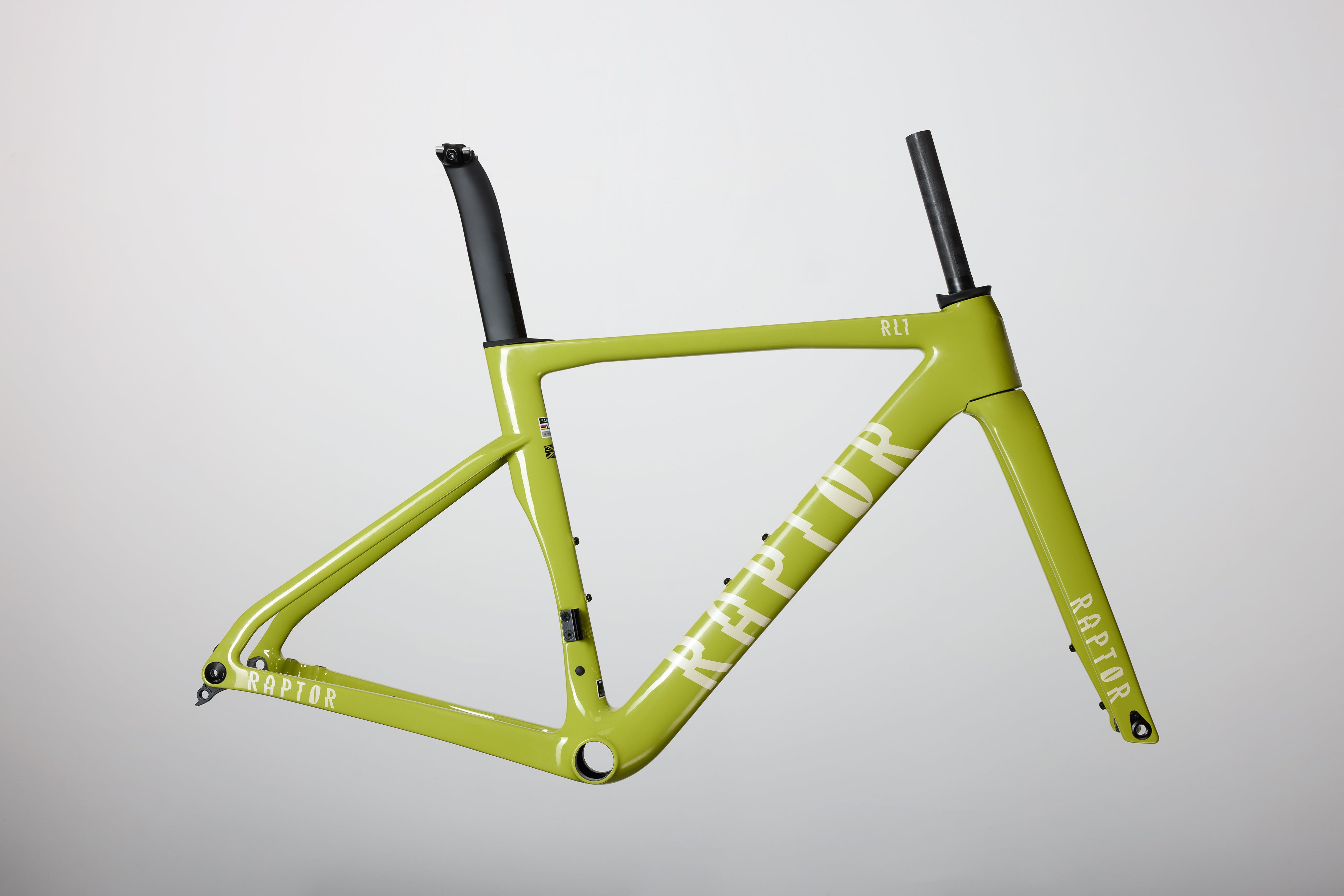 Green bicycle frame with black accents on a light gray background